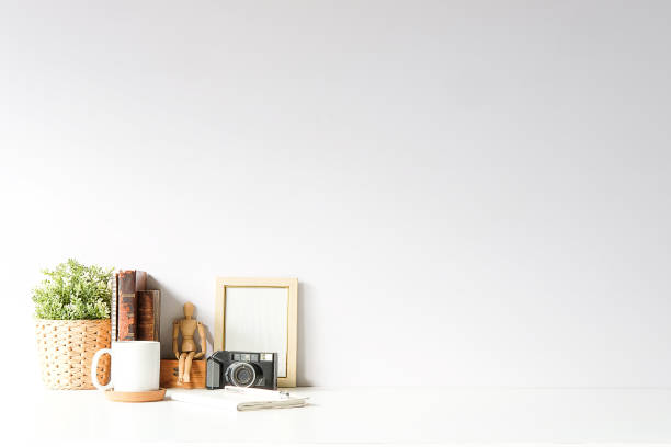 istock Mockup workspace desk and copy space books,plant and coffee on white desk. 1224488018