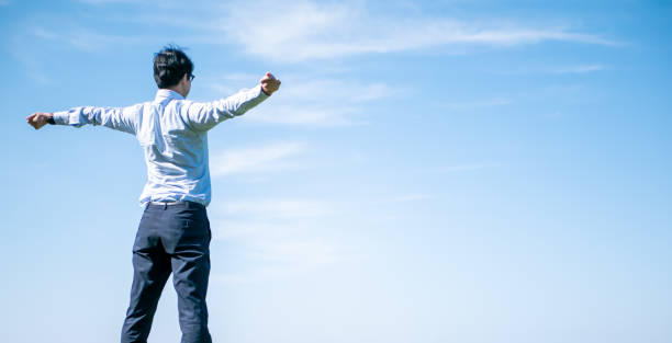 istock A businessman stands under a blue sky 1224490902