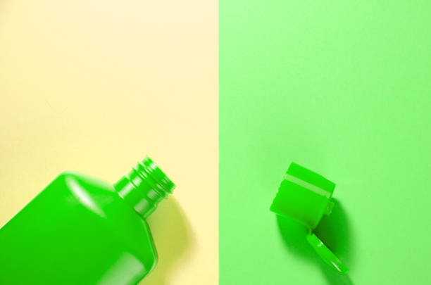 istock green shampoo bottle on a yellow and green background with empty place for text 1224492193