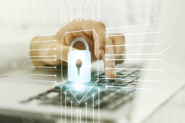 istock Creative idea concept with lock symbol and microcircuit illustration and hands typing on laptop on background. Protection and firewall concept. Multiexposure 1224494118