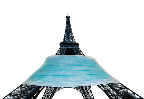 Eiffel tower or Tour Eiffel with surgical mask, symbol of Paris with Covid-19 isolated on white background. France and SARS-CoV-2 pandemic. French at time of Coronavirus and quarantine.