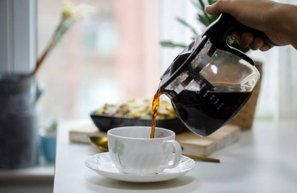istock pouring coffee to coffee cup at breakfast 1224498635