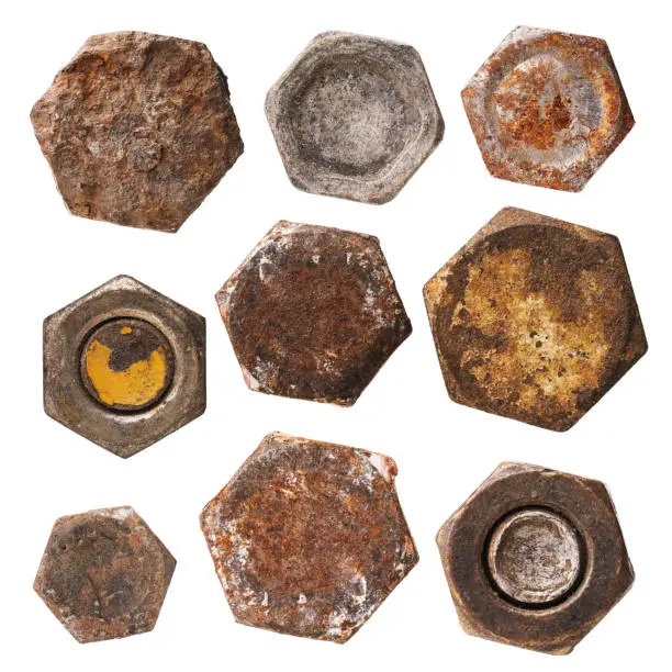 Photo of Set of various rusty heads of bolts and nuts isolated on a white background