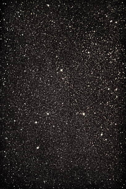 istock black giltter background. Sparkle texture .Christmas, party abstract backdrop with copy space. 1224503176