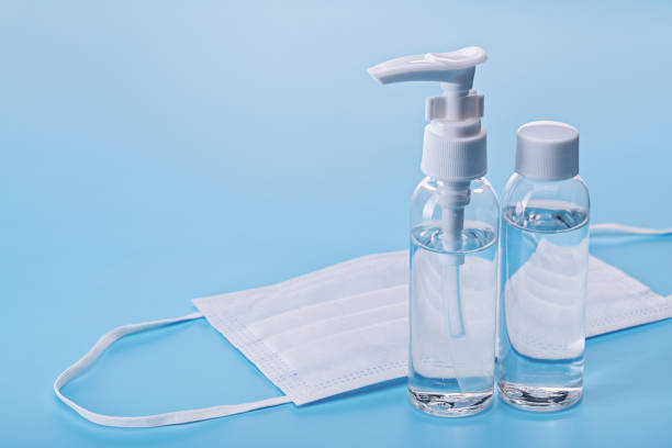 istock Disinfectants, spray bottles and face masks. 1224504996