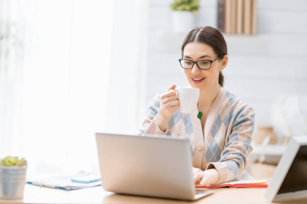 istock woman working on a laptop at home. 1224505009