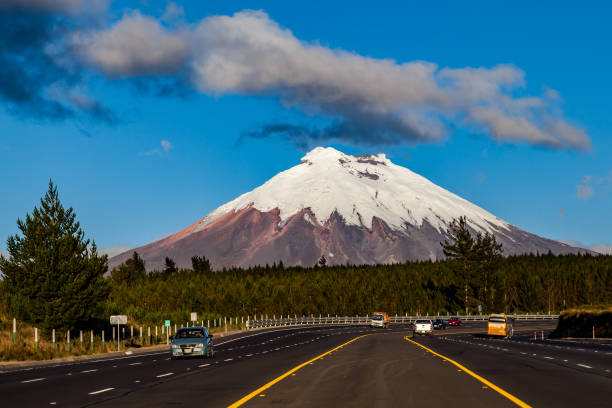 Cotopaxi National Park Cotopaxi volcano seen from the Pan-American highway at sunset cotopaxi photos stock pictures, royalty-free photos & images