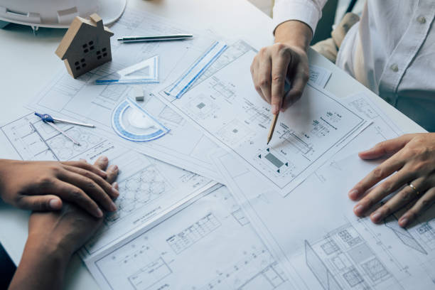 istock The partnership engineering man or co-workers working on a project and discussing together with looking at blueprint paperwork. 1224506771