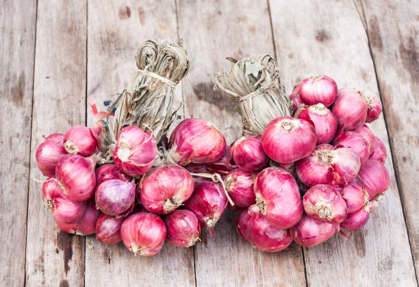 Red onions group on grunge texture wooden background