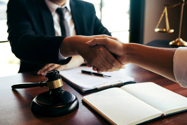 istock Lawyer is currently shaking hands with the client about the success in resolving the case. 1224508038