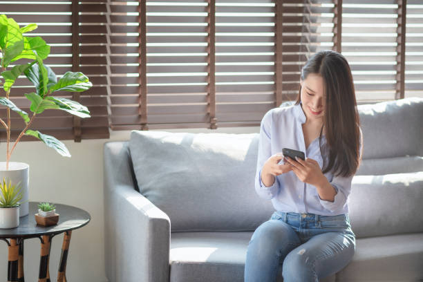 istock Beautiful woman using mobile phone and internet technology 1224508714
