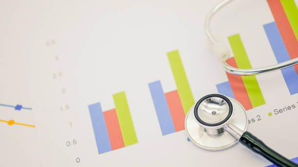 istock Closeup of stethoscope on paper graph and white background with copy space for text. 1224509483
