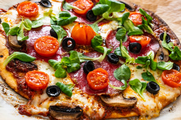 istock Pepperoni pizza on baking paper 1224512291