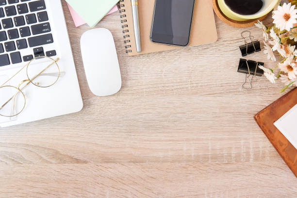 istock Top view office stuff with notepad, laptop and coffee cup mouse notepad shot.blank screen mobile phone and supplies on white desk workspace and copy space. 1224513326