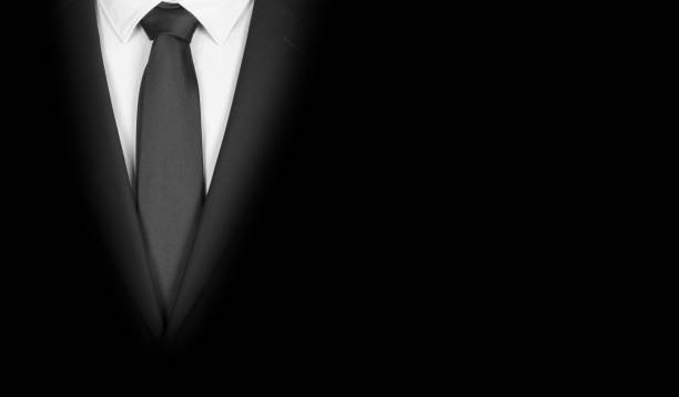 istock Man in a black suit with black tie, close-up 1224513407