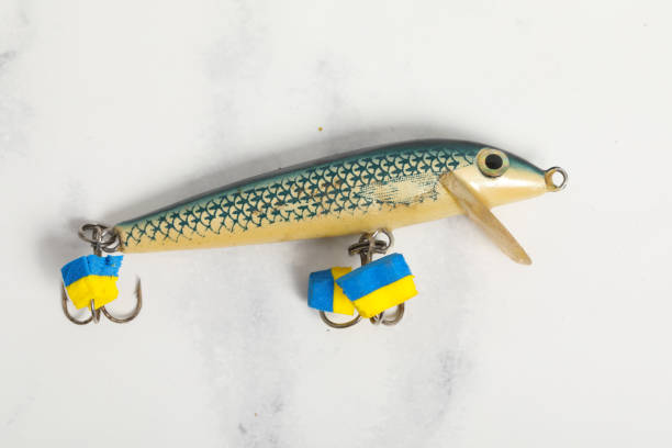 istock spinning fishing lures for predator , green hook 1224513579