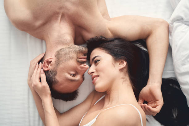 istock Blissful wife lying next to her husband 1224513671