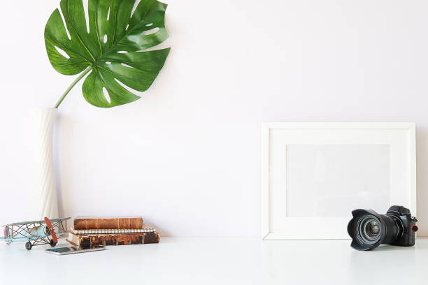 istock Mockup workspace desk and copy space books,plant and coffee on white desk. 1224513952