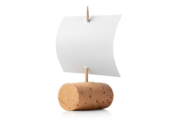 Simple success solution. Wine cork sail boat. Wine cork sail boat isolated on white background. cork material stock pictures, royalty-free photos & images
