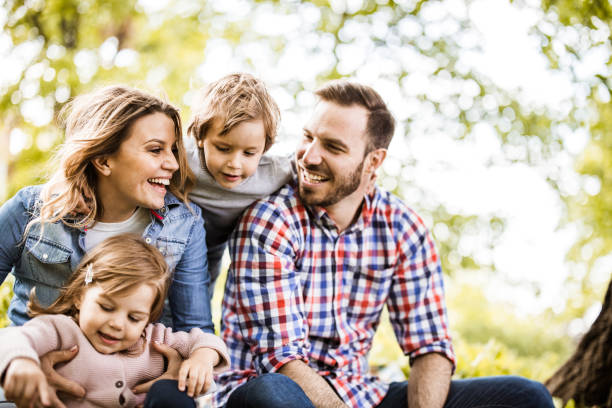 istock Young happy family enjoying while spending a spring day in nature. 1224515060