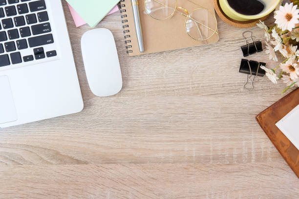 istock Top view office stuff with notepad, laptop and coffee cup mouse notepad shot.blank screen mobile phone and supplies on white desk workspace and copy space. 1224515389