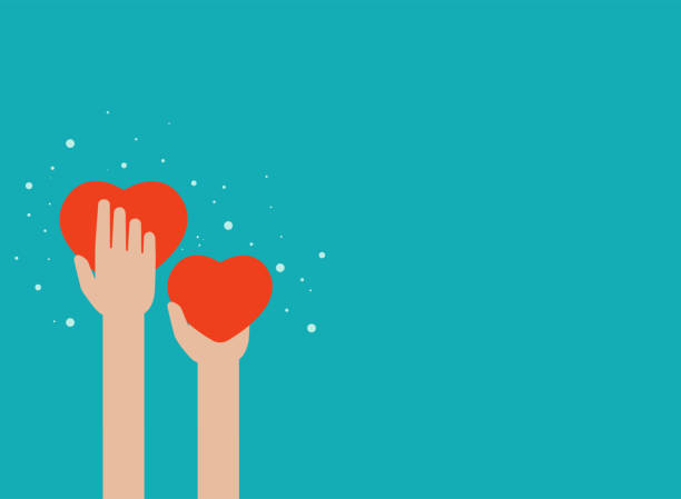istock Hands holding red hearts on blue background. worldwide on-line help and support concept. 1224517627