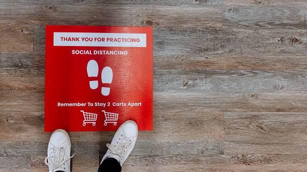 istock Social distancing sign on the floor 1224517741