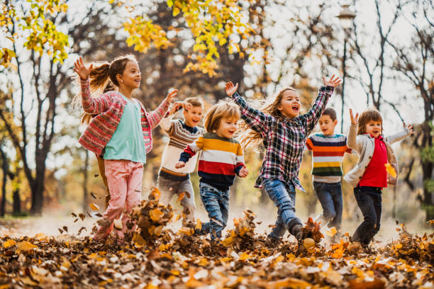 istock Carefree children having fun while running in the park. 1224517893