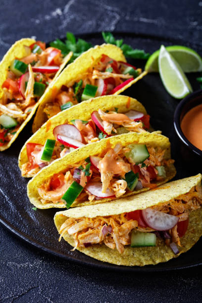 istock Buffalo Chicken Corn Taco shells loaded with fresh greens and vegetables 1224517924