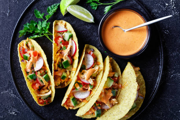 istock Buffalo Chicken Corn Taco shells loaded with fresh greens and vegetables 1224517926