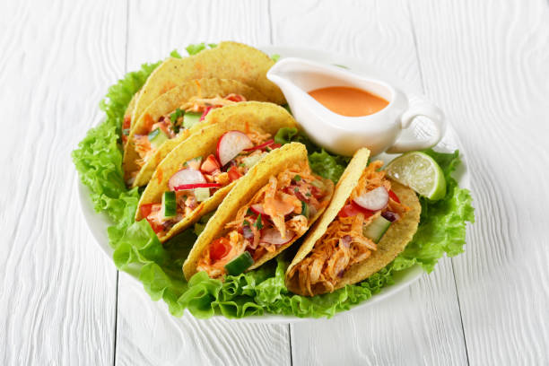 istock Buffalo Chicken Corn Taco shells loaded with fresh greens and vegetables 1224518558