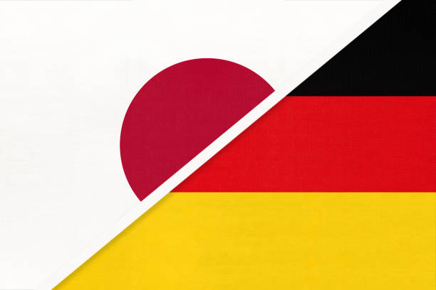 istock Japan vs Germany, symbol of two national flags. Relationship between Asian and European countries. 1224518600