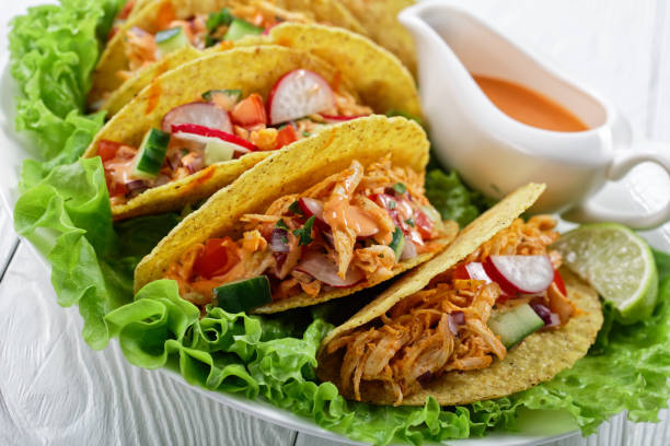 istock Buffalo Chicken Corn Taco shells loaded with fresh greens and vegetables 1224518643
