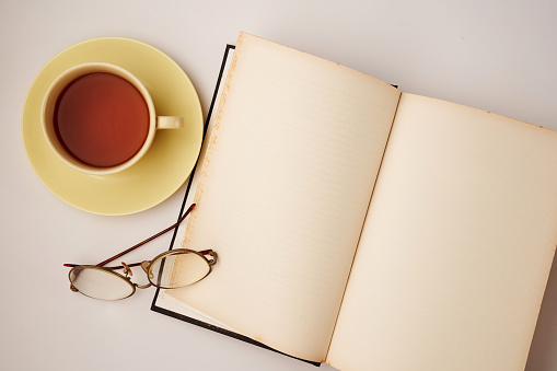 blank book and cup of tea