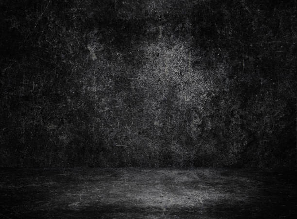 istock Studio dark room black concrete grunge wall with concrete floor. 1224521872