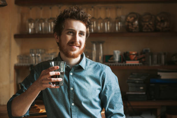 istock Hipster man drinking a glass of coke 1224524420