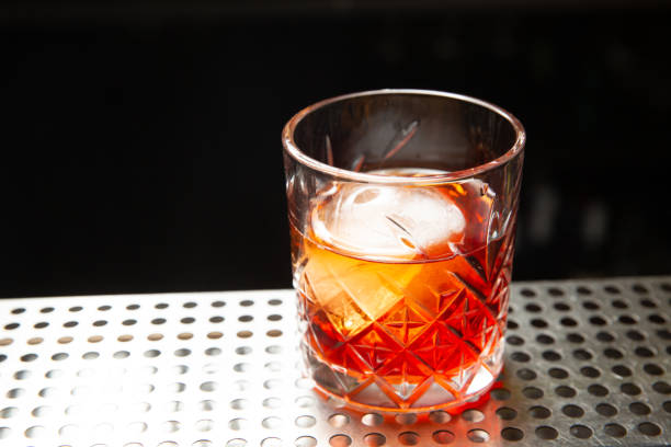 istock Whiskey with an ice ball in a glass 1224525564