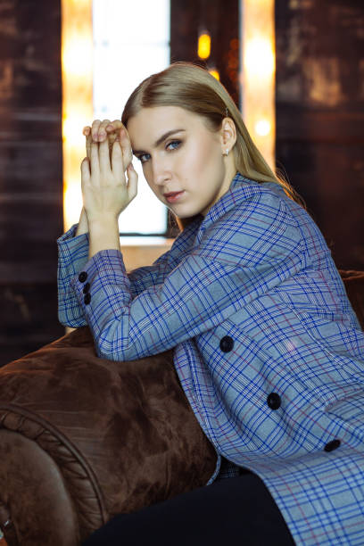 istock Young attractive blonde in a blue checkered jacket 1224525850