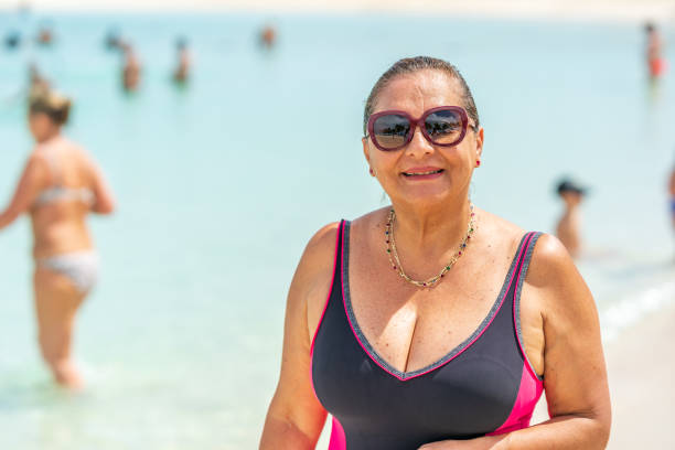 istock Senior Hispanic woman on Caribbean beach 1224526663