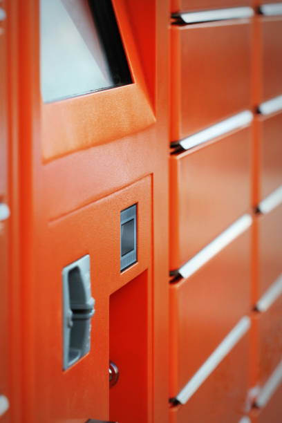istock Self-service terminal for parcel post with orange facade. Concept: delivery, self, easy, simple. 1224528535