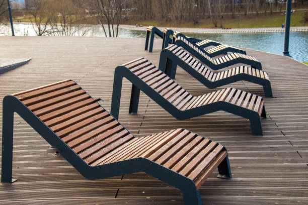 istock Sun loungers  on platform on lake 1224532822