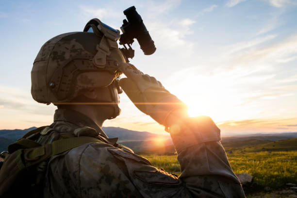 istock Silhouette Of A Saluting Solider  against sunset sky 1224533028