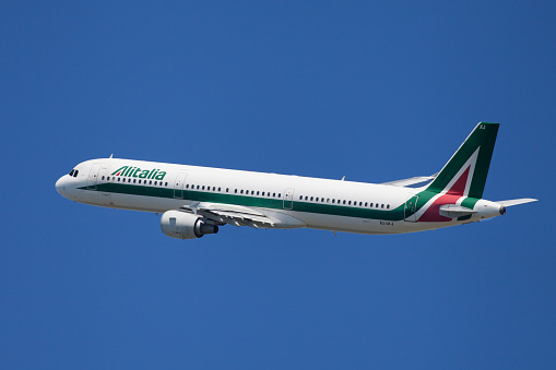 Barcelona, Spain - June 02, 2019: Alitalia Airbus A321 banking left after taking off from El Prat Airport in Barcelona, Spain.