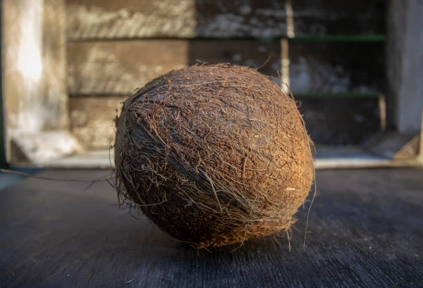 istock whole coconut on wooden background 1224536154