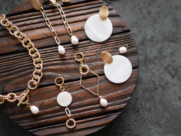 istock Gold jewelry on a tree. flat lay 1224536703