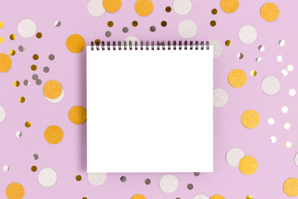 istock Empty notepad mockup on a purple pastel background. Round confetti texture. 1224537408