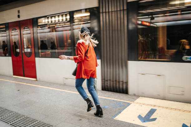 istock Woman running to catch the train 1224537413