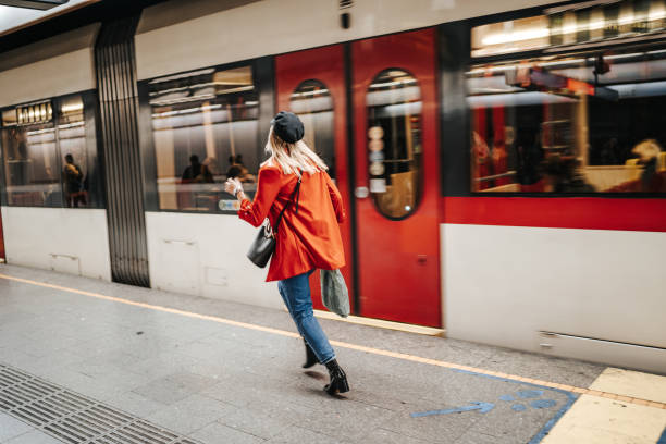 istock Woman running to catch the train 1224537760