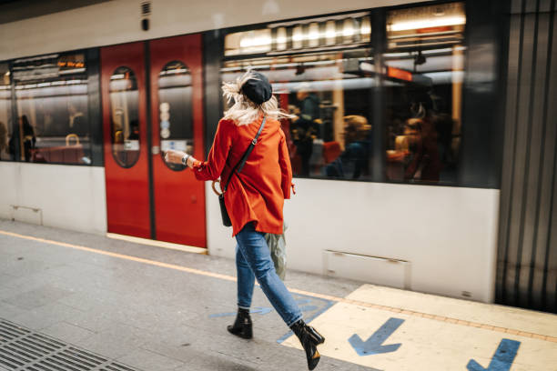 istock Woman running to catch the train 1224537979