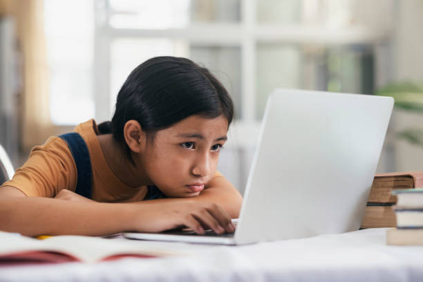 istock Happy asian girl learning online at home 1224538570